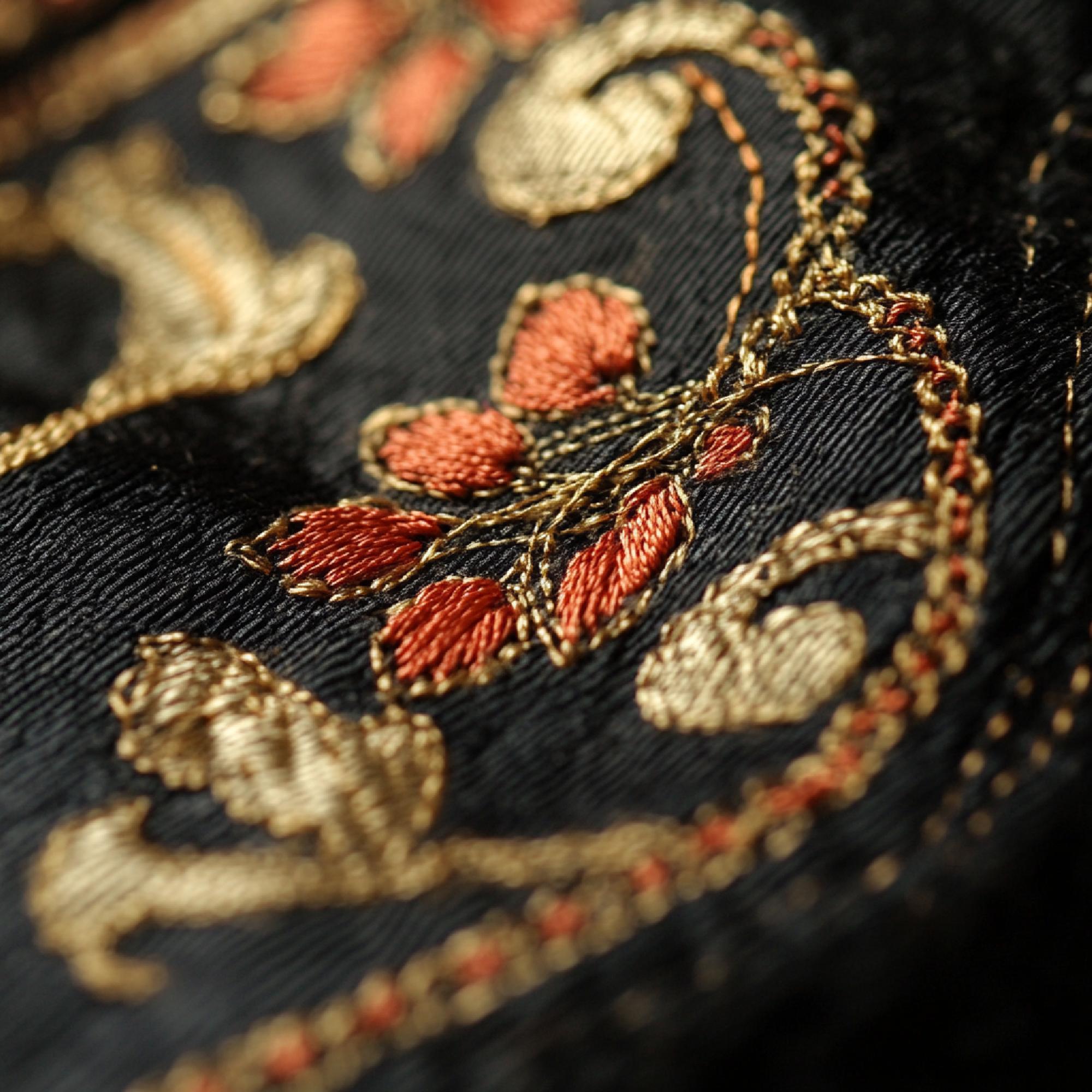Assortment of embroidered samples on fabric